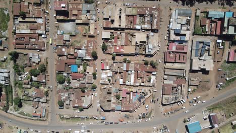 Everyday-street-life-in-African-town,-birds-eye-perspective-on-houses-and-infrastructure