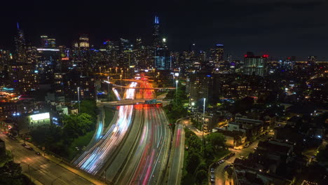 Hyperlapse-drone-shot-of-traffic-on-the-90-94-Interchange,-night-in-River-West,-Chicago,-USA
