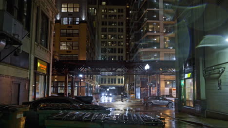 Elevated-train-in-middle-of-wet-streets,-rainy-evening-in-Chicago,-Illinois,-USA