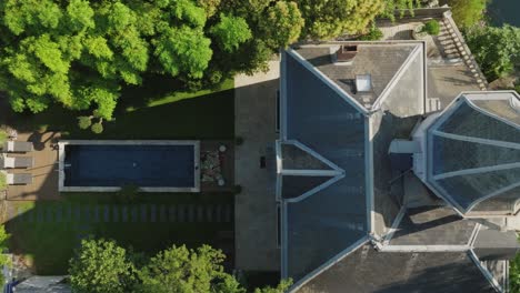 Aerial-top-down-showcasing-a-castle-like-villa-with-a-private-pool-on-the-Lez-River