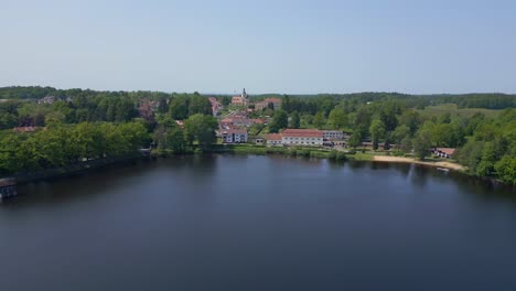 Nice-aerial-top-view-flight-Vacation-paradise-village-Chlum-at-Lake-Hejtman-in-Czech-Summer-day-2023
