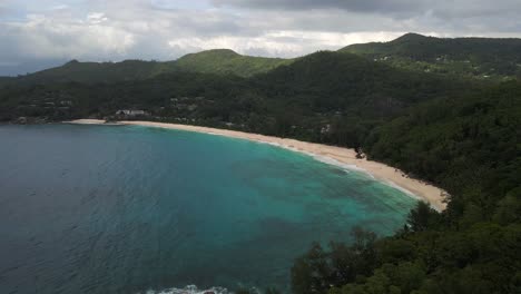 landscapes-in-Seychelles-filmed-with-a-drone-from-above-showing-the-ocean,-rocks,-palm-trees-on-the-main-island-Mahe