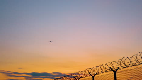 Aircraft-In-Flight-Leaving-Warsaw-Chopin-Airport-During-Sunset-In-Poland