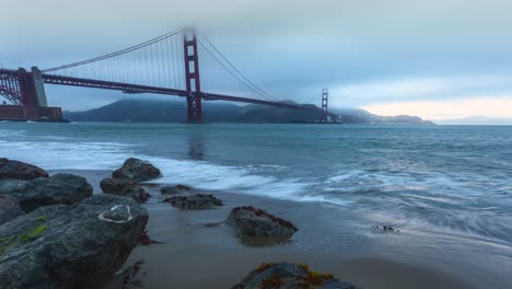Barge-Passing-Under-The-Golden-Gate-Bridge-On-A-Foggy-Day-In-San-Francisco,-USA