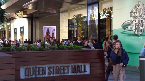 Static-shot-capturing-large-crowds-of-people-in-bustling-downtown-Brisbane-city,-strolling-and-shopping-at-iconic-Queen-street-mall,-outdoor-pedestrian-shopping-mall-at-Queensland-Australia