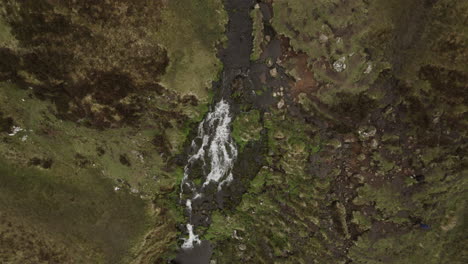 Rotating-Bird's-Eye-View-Of-Waterfall,-Isle-Of-Skye,-Scotland