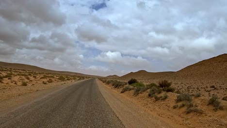 Driving-on-Tunisian-desert-road,-driver-point-of-view