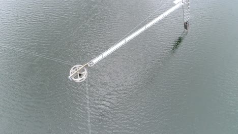 Drone-shot-of-the-mechanic-pulling-poles-at-a-watersport-park