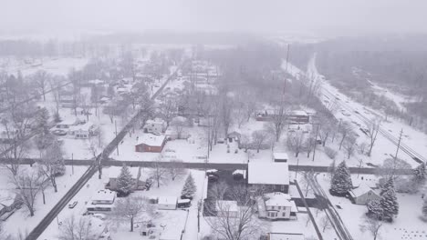 Small-town-Midwest-town-in-Michigan---Carlton-in-winter-season,-aerial-view