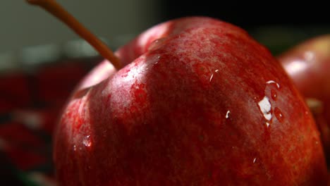 Cinematic-Close-Up-of-Apple-in-Fruit-Bowl-with-Water-Drops