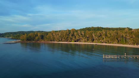 Wooden-footbridge-Beautiful-aerial-top-view-flight-natural-beach-bay-thailand,-wood-pier-golden-hour,-lagoon-koh-kood-2022
