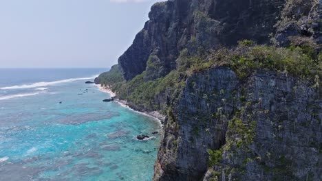 Drone-view-of-cliffs-at-Playa-Fronton-beach-in-Las-Galeras-Samana,-Dominian-Republic