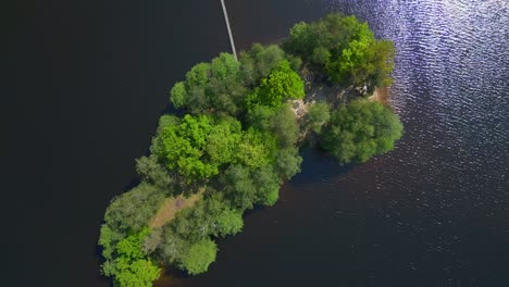 speed-ramp-Dramatic-aerial-top-view-flight-Natural-Summer-Paradise-idyllic-Island-in-Lake,-Chlum-in-Czech,-day-2023