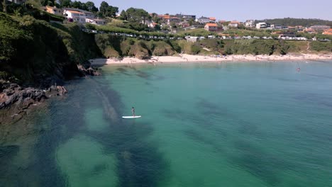 Orbital-Footage-of-Jade-Ocean-Peaceful-Beach-Next-to-Cliff-in-Galicia