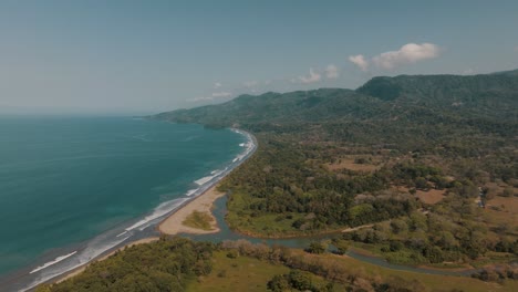 Panoramic-View-Of-Whale-Tail-Uvita-Beach-With-Forested-Mountains-In-Costa-Rica,-Central-America