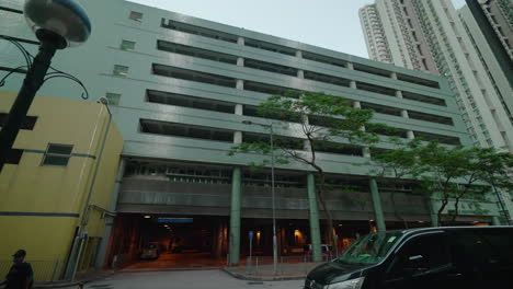 Handheld-street-view-of-stylish-multilevel-parking-lot-in-Hong-Kong