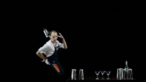 Bartender-juggling-the-objects-on-black-background