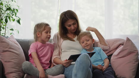 Woman-and-kids-enjoy-watching-educational-lessons-together