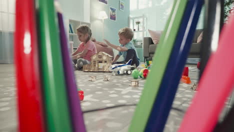 Children-make-structures-from-plastic-constructor-blocks