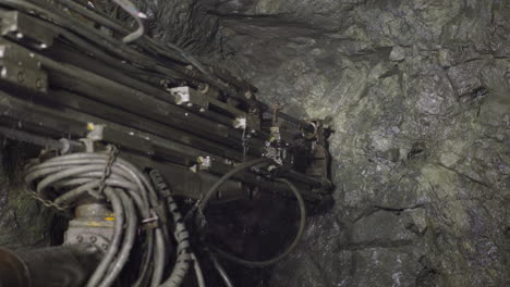 Professional-equipment-drills-holes-in-rocks-of-ore-mine
