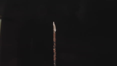 Rusty-needle-of-old-medical-syringe-on-black-background