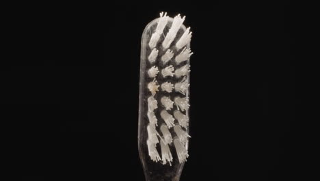 Transparent-plastic-toothbrush-with-hard-white-bristles