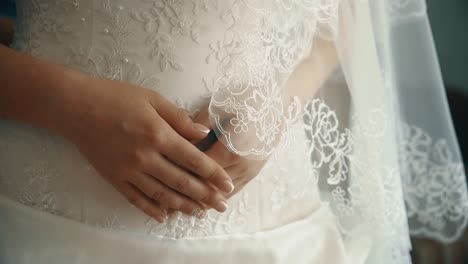 Young-beautiful-bride-worried-before-the-wedding-hands-close-up