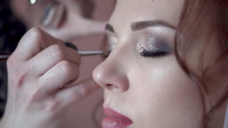 make-up-artist-paints-the-eyes-of-the-bride-in-the-morning-before-the-wedding-close-up-slow-motion