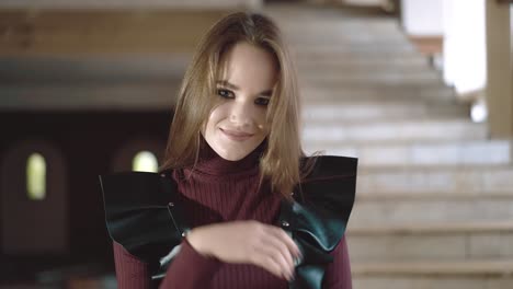 Portrait-of-a-young-beautiful-girl-dressed-in-leather-wings-close-up