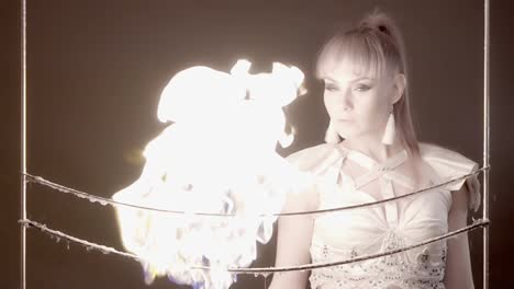 CU-Slow-motion-Tricks-with-soap-bubbles-The-girl-sets-fire-to-the-bubble-with-lighter