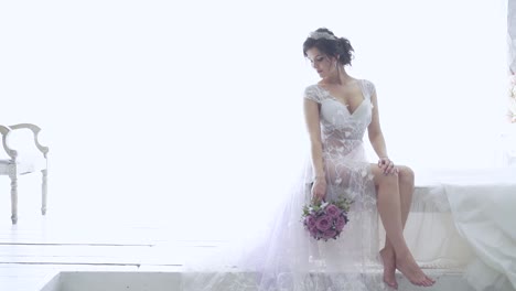 slow-motion-young-bride-in-white-long-lacy-dressing