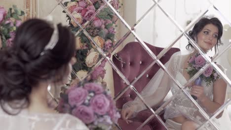 young-woman-in-wedding-dress-reflects-in-mirror-slow-motion