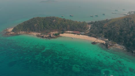 aerial-blue-ocean-coast-with-tropical-forest-and-sand-beach