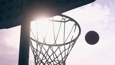 ball-flies-and-gets-into-basket-at-sunset-light-slow-motion