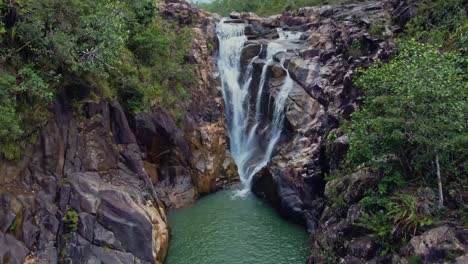 Aerial-away-from-Big-Rock-Falls-in-the-Mountain-Pine-Ridge-Forest-Reserve,-Belize