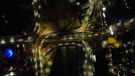 Hyperlapse-drone-shot-top-of-traffic-at-a-overpass-in-Monterrey,-night-in-Mexico
