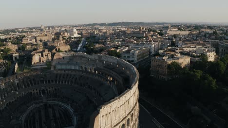 Aerial-view-of-Rome's-Colosseum-overlooking-the-surrounding-neighborhood-in-Italy