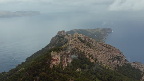 Overcast-Sky-Under-Talaia-d'Alcúdia-Mountain-Peaks-Overlooking-Punta-de-s'-Almadrava-In-Mallorca-Islands,-Spain
