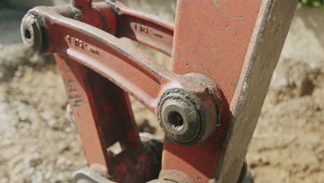 Close-up-shot-of-a-connection-joint-on-a-mini-excavator
