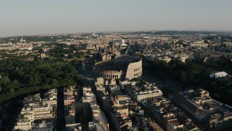 Wide-aerial-view-of-Rome's-Colosseum-surrounded-by-Italy's-sprawling-neighborhoods