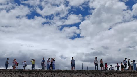 Slow-motion-static-shot-of-tourists-taking-photos-of-the-Teotihuacan-Pyramids-in-Mexico
