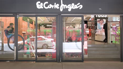 Pedestrians-walk-past-the-Spanish-biggest-department-store-El-Corte-Ingles-and-logo-seen-in-Spain