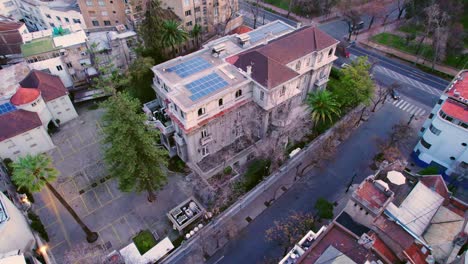 Aerial-orbit-over-the-Bruna-Palace-in-the-bohemian-Lastarria-neighborhood,-residential-and-touristic-district-of-Santiago-Chile