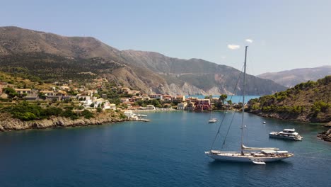 Large-sailing-boat-docked-in-the-bay-of-picturesque-village-Asos,-Greece,-drone