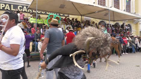 Immerse-yourself-in-the-enchanting-Diablada-Pillareña-dance-as-a-masked-performer-sways-and-dances-during-the-Chagra-Processional-Parade