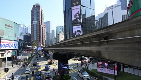 Iconic-and-busy-Bukit-Bintang-district-of-Kuala-Lumpur-with-its-monorail-train-station,-Malaysia