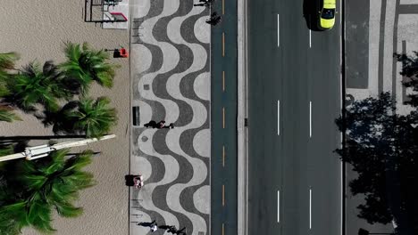 Top-View-Atlantic-avenue-and-the-famous-Sidewalk-patern-at-Copacabana-Beach,-Rio-De-Janeiro,-Brazil