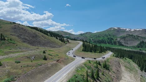 Aerial-of-vehicles-travelling-down-the-roads-of-Cottonwood-Pass,-Colorado,-USA