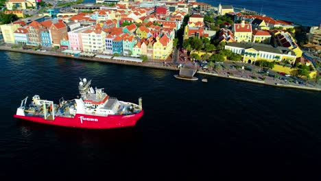 Coast-guard-safety-marine-vessel-drives-through-entrance-of-harbor-port-in-willemstad-curacao