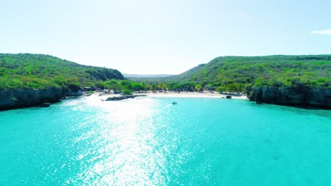 Drone-dolly-to-turquoise-water-of-curacao-and-pristine-hidden-beach-cove-getaway